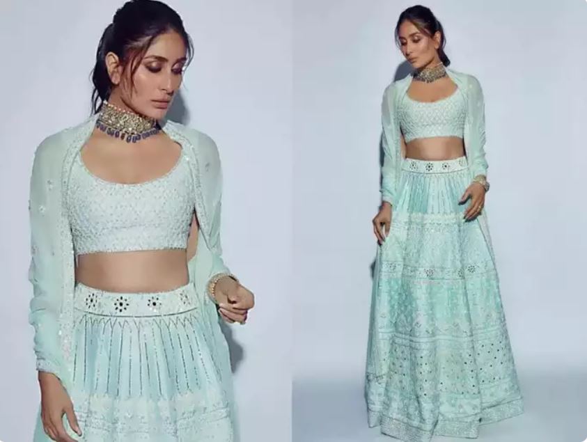 Kareena made a statement in delicate-mirror work lehenga. She picked an icy blue lehenga set with embroidery highlight with mirror-work. She styled the dupatta over her shoulders and accessorised her look with a diamond choker. 